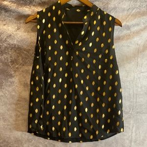 Black sleeveless blouse with gold dots